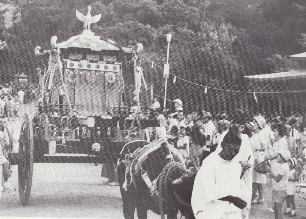 A portable shrine transported by ox cart (post-WWII)